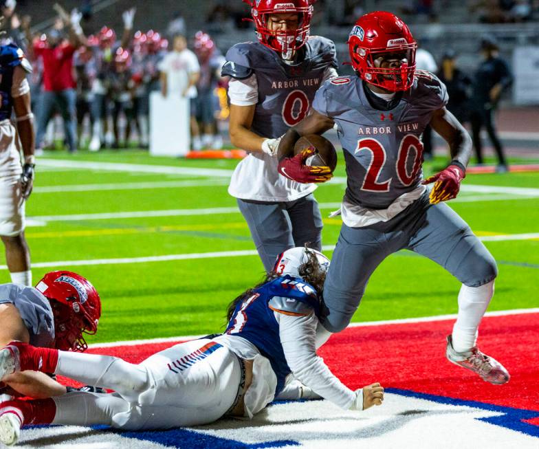 Arbor View running back Kamareion Bell (20) fights into the end zone against Liberty during the ...