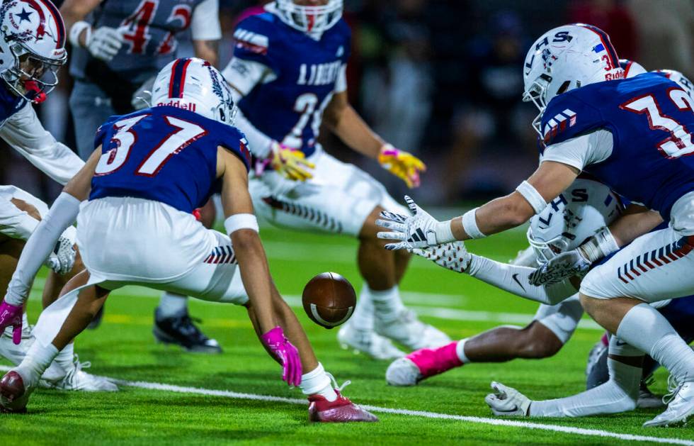 Liberty players attempt to secure an on side kick against Arbor View which failed to go 10 yard ...