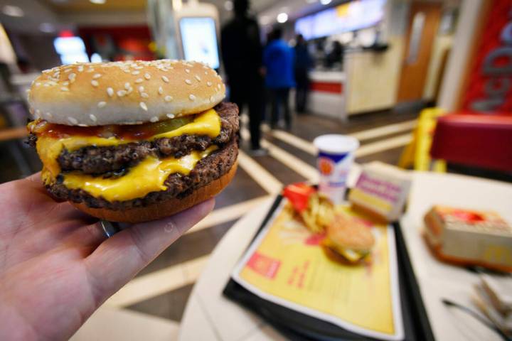 FILE - A McDonald's Double Quarter Pounder is shown on March 6, 2018, in Atlanta. (AP Photo/Mik ...