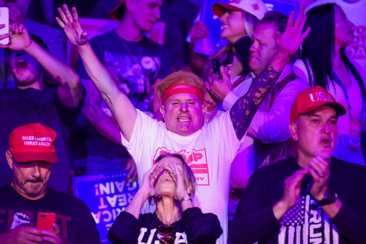 Supporters of Republican presidential nominee former President Donald Trump get pumped up durin ...