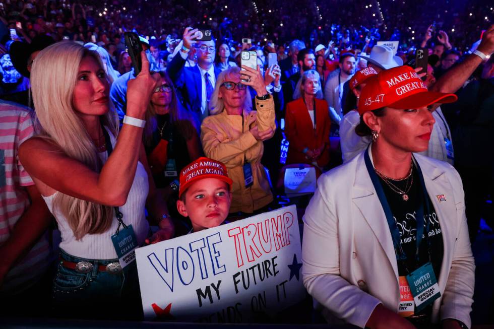 Supporters wait for Republican presidential nominee former President Donald Trump to speak duri ...