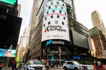 Advertising for Keurig Dr Pepper on the giant Nasdaq video screen in Times Square in New York, ...