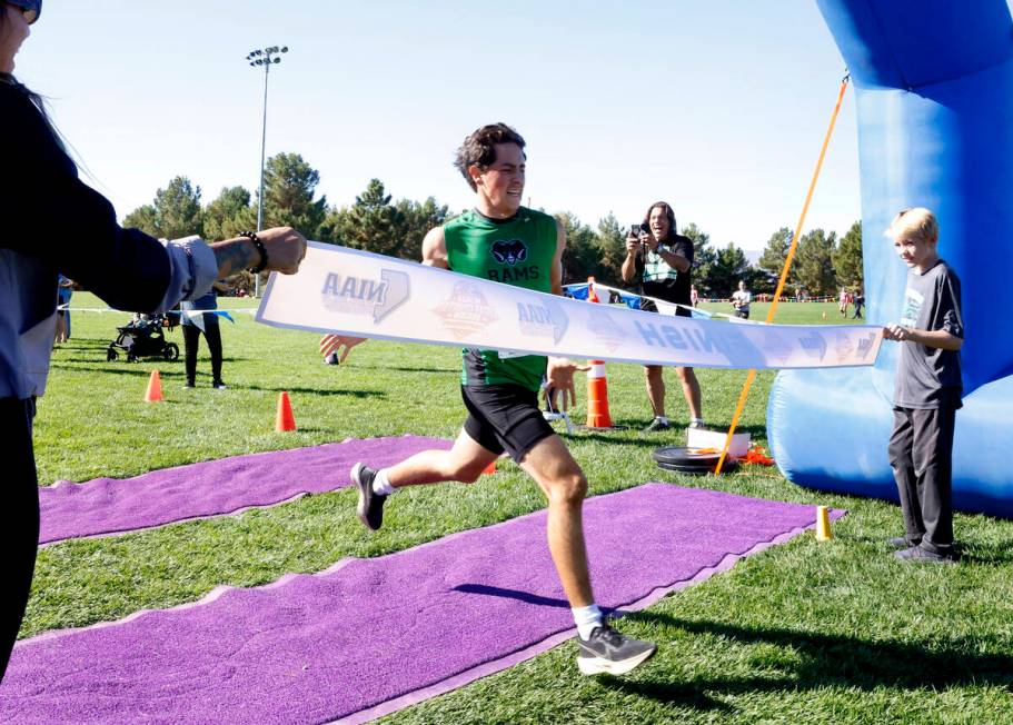 Emmanuel Salinas of Rancho crosses the finish line during the 4A Desert boys cross country meet ...