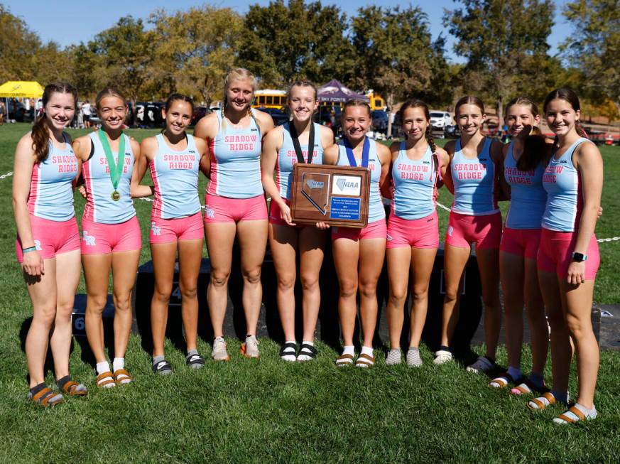 Shadow Ridge High School runners pose for a photo after winning the 5A Southern Region girls cr ...