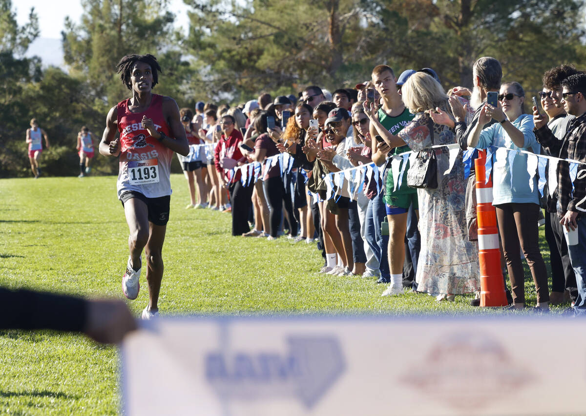 Kenan Dagge of Desert Oasis approaches the finish line during the 5A Southern boys cross countr ...