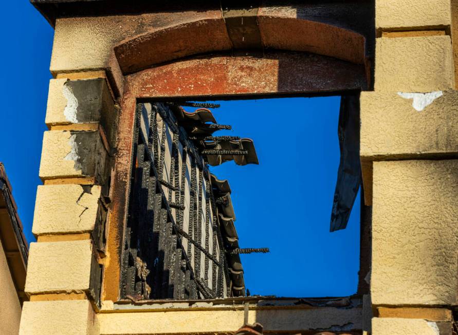 Damage from within a window on the exterior of fatal house fire at 8332 Langhorne Creek Street ...