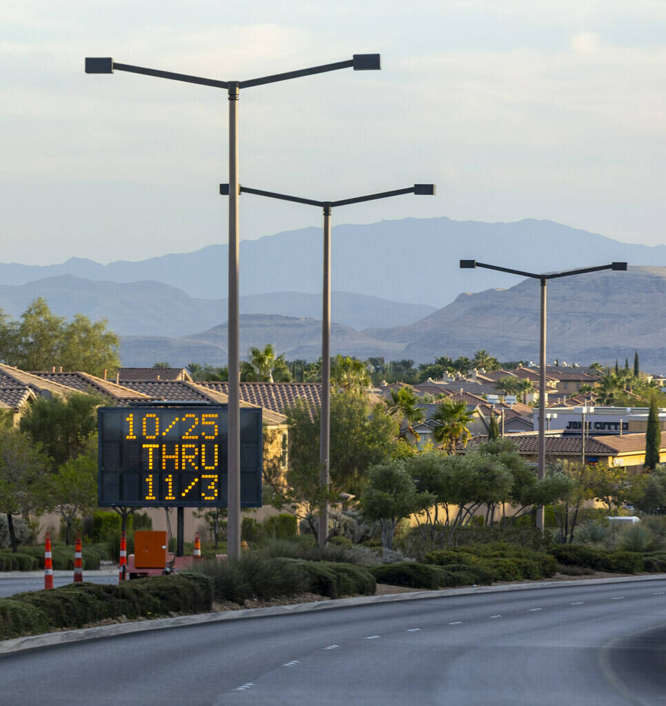 Signage on Desert Foothills Drive southbound warning of major delays the next week along W. Cha ...