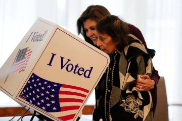 Republican presidential candidate former UN Ambassador Nikki Haley helps her mother Raj Kaur Ra ...