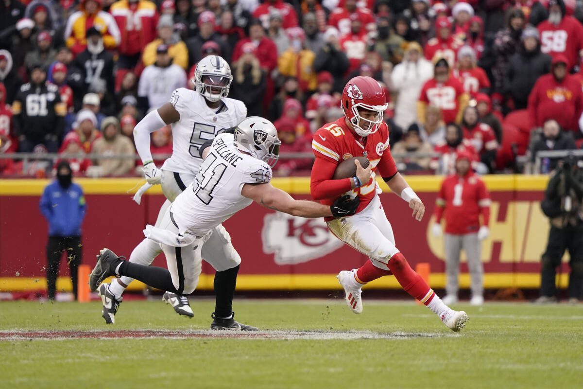 Kansas City Chiefs quarterback Patrick Mahomes (15) runs against Las Vegas Raiders linebacker R ...