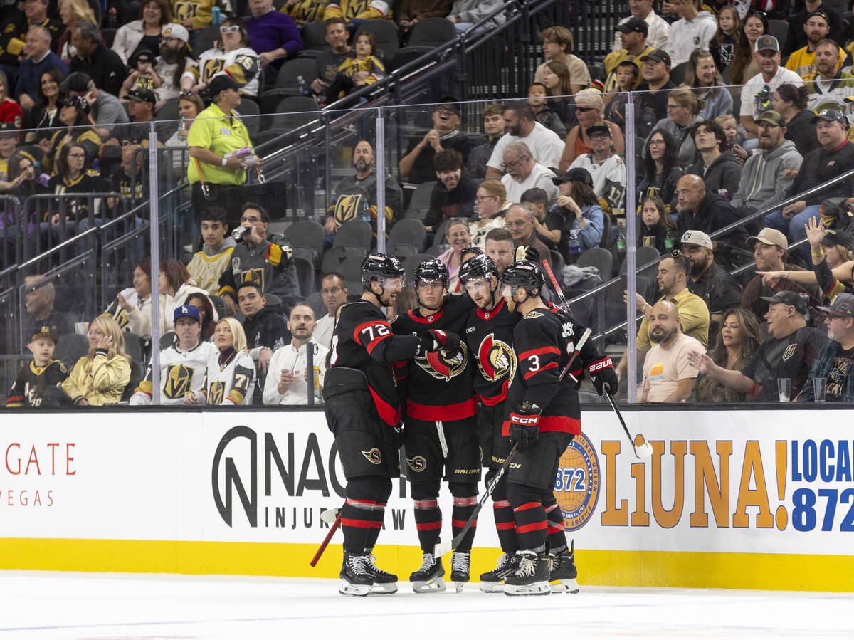 The Ottawa Senators celebrate a goal during the first period of the NHL hockey game against the ...