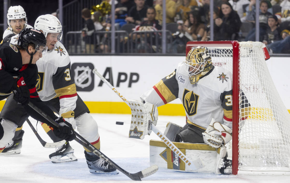 Golden Knights goaltender Adin Hill (33) blocks a shot during the second period of the NHL hock ...