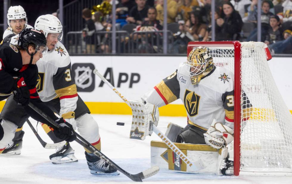 Golden Knights goaltender Adin Hill (33) blocks a shot during the second period of the NHL hock ...