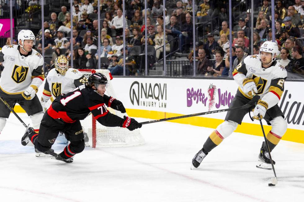 Ottawa Senators center Ridly Greig (71) dives after Golden Knights defenseman Shea Theodore (27 ...