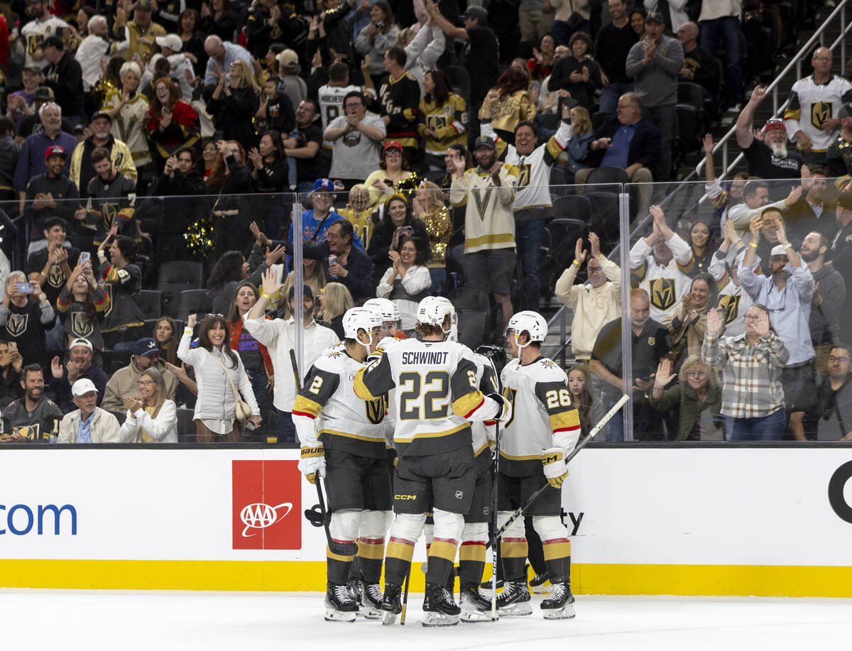 The Golden Knights celebrate a goal during the first period of the NHL hockey game against the ...