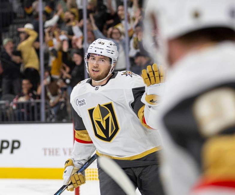 Golden Knights center Ivan Barbashev (49) shrugs after scoring an empty-net goal during the thi ...