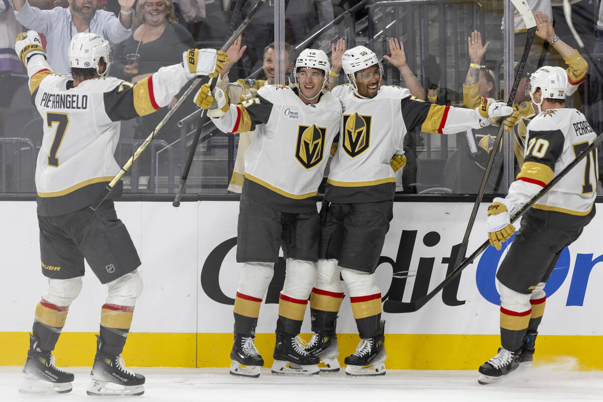 The Golden Knights celebrate a goal during the third period of the NHL hockey game against the ...