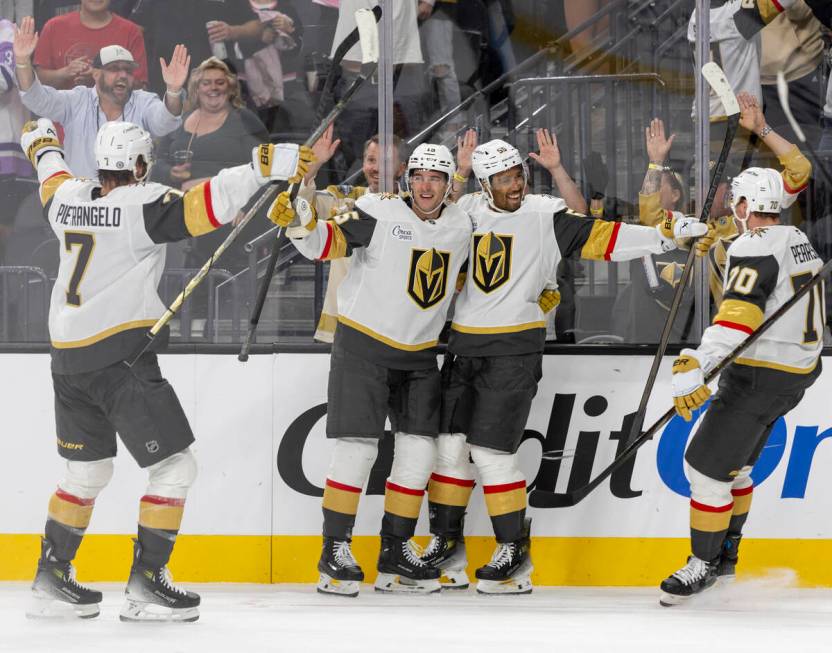 The Golden Knights celebrate a goal during the third period of the NHL hockey game against the ...