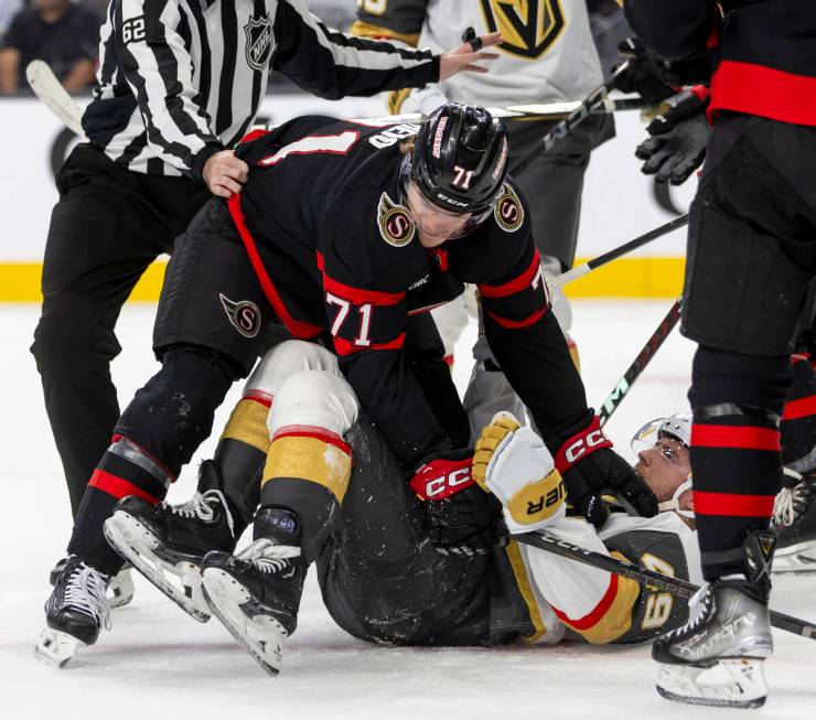 Ottawa Senators center Ridly Greig (71) pushes on Golden Knights center Ivan Barbashev (49) dur ...