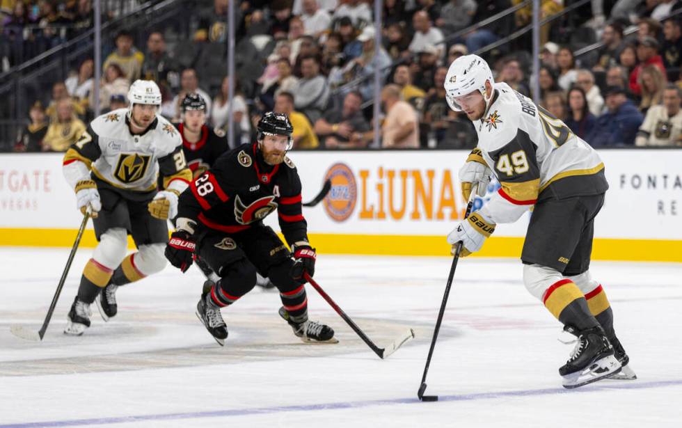 Golden Knights center Ivan Barbashev (49) controls the puck during the NHL hockey game against ...