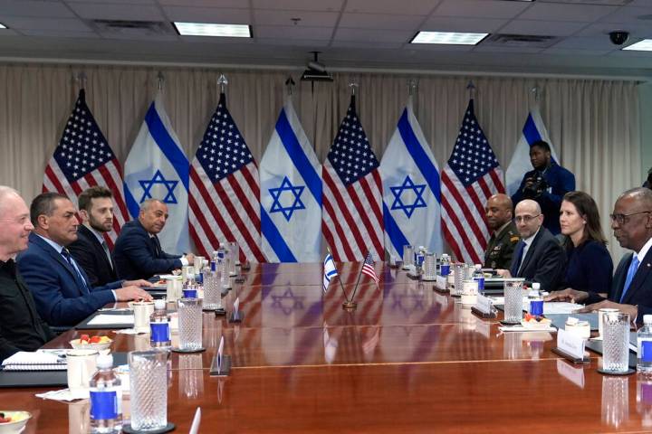 Defense Secretary Lloyd Austin, right, and Israeli Defense Minister Yoav Gallant, second from l ...