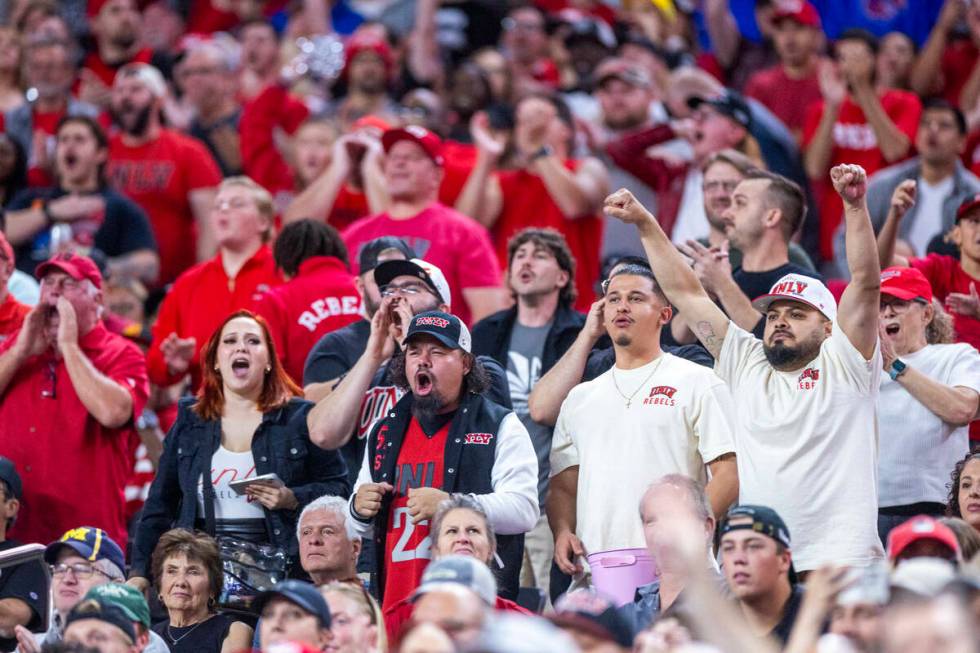 UNLV fans cheer their team on against the Boise State Broncos during the first half of their NC ...