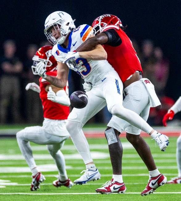 Boise State Broncos wide receiver Chase Penry (13) has a pass broken up by UNLV defensive back ...