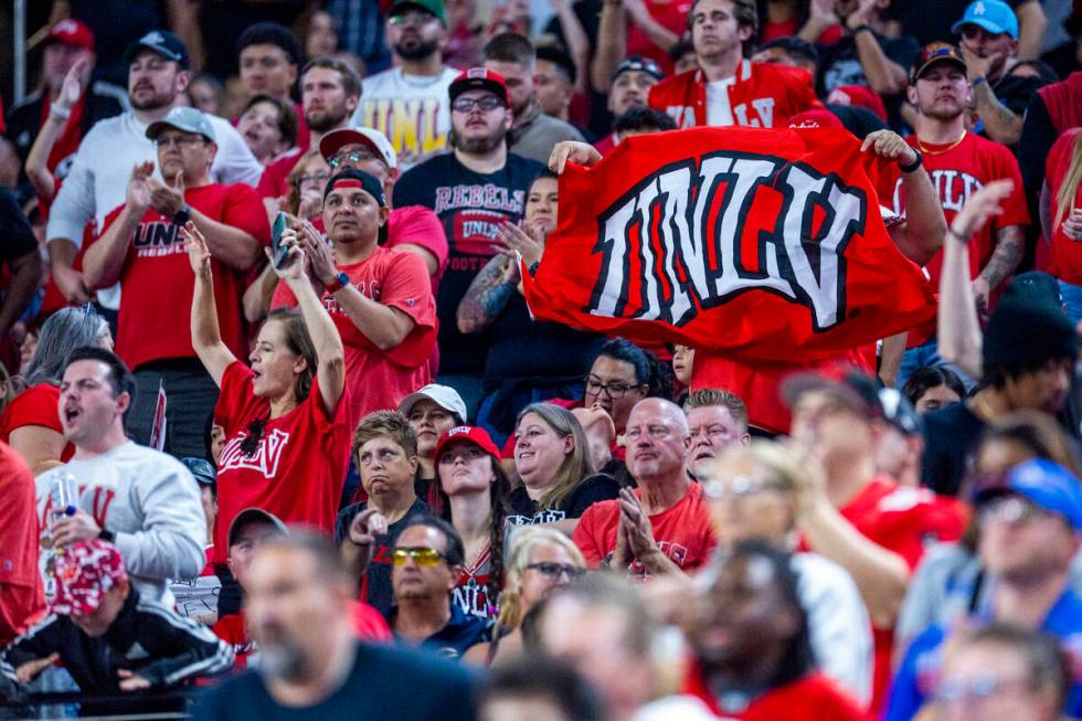 UNLV fans attempt to stay upbeat after another Boise State Broncos score during the first half ...