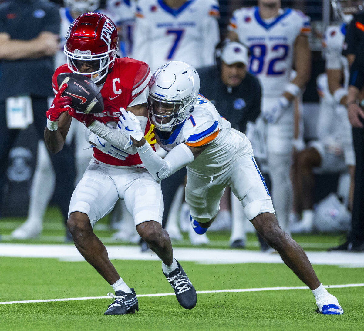 UNLV wide receiver Ricky White III (11) pulls in a pass against Boise State Broncos cornerback ...