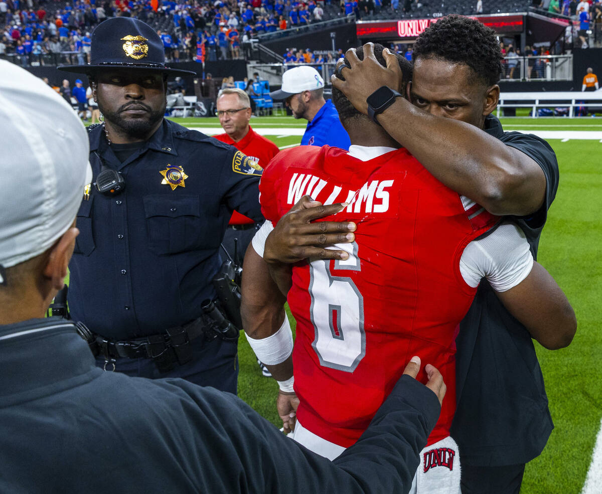 UNLV quarterback Hajj-Malik Williams (6) is comforted on the field after a gritty performance a ...