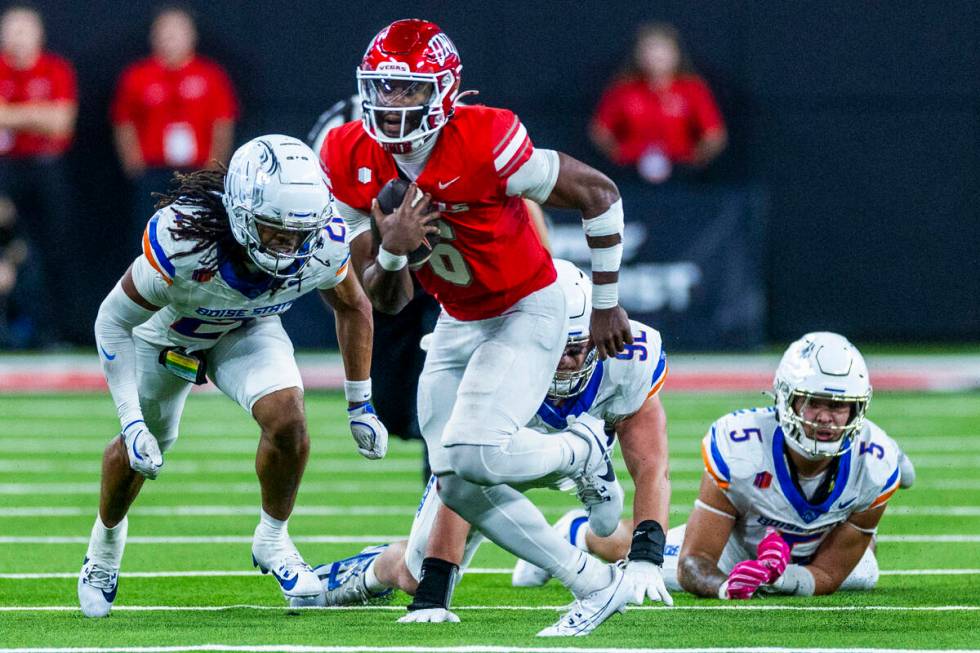 UNLV quarterback Hajj-Malik Williams (6) looks for more yards on a first down run as Boise Stat ...