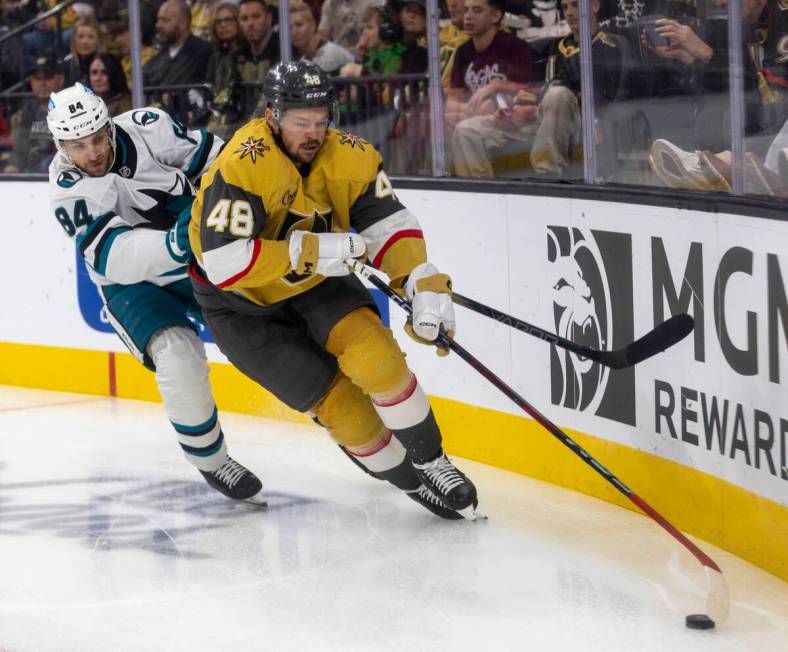 Golden Knights center Tomas Hertl (48) keeps the puck from San Jose Sharks defenseman Jan Rutta ...