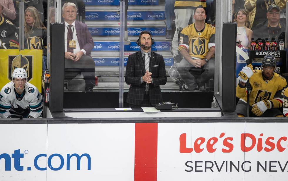 Color commentator Shane Hnidy reports between the team benches during the third period of the N ...