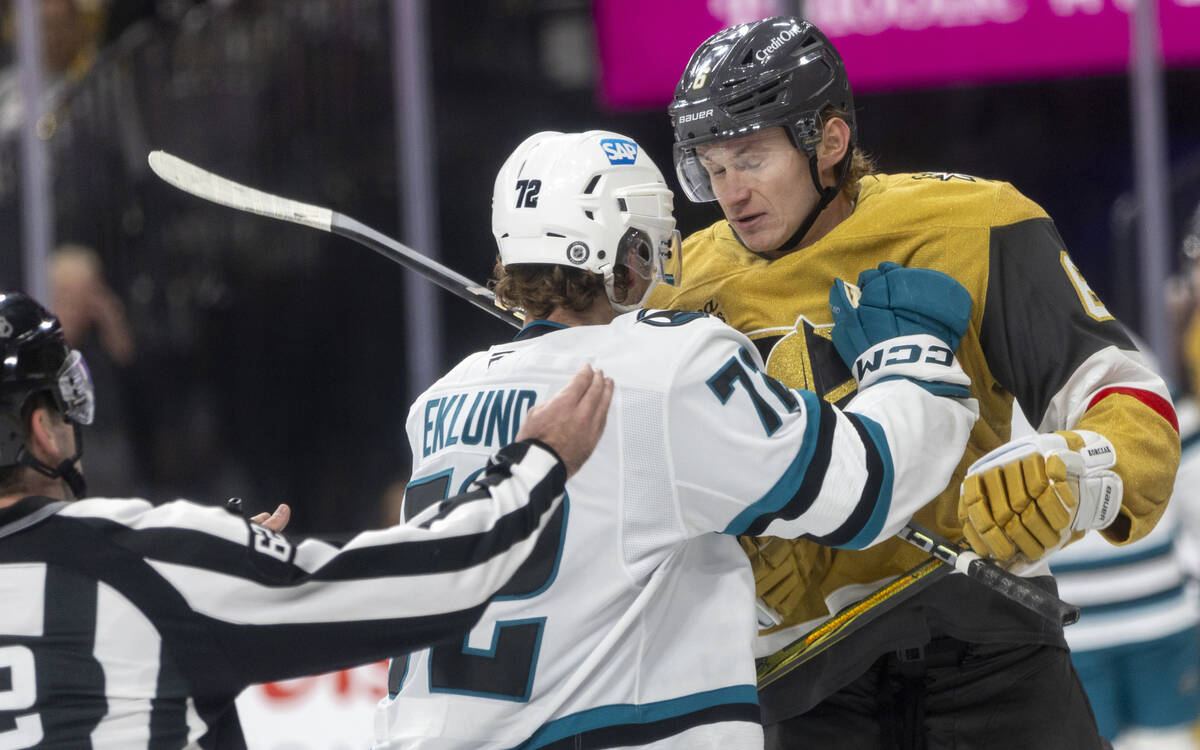 San Jose Sharks left wing William Eklund (72) shoves Golden Knights defenseman Kaedan Korczak ( ...