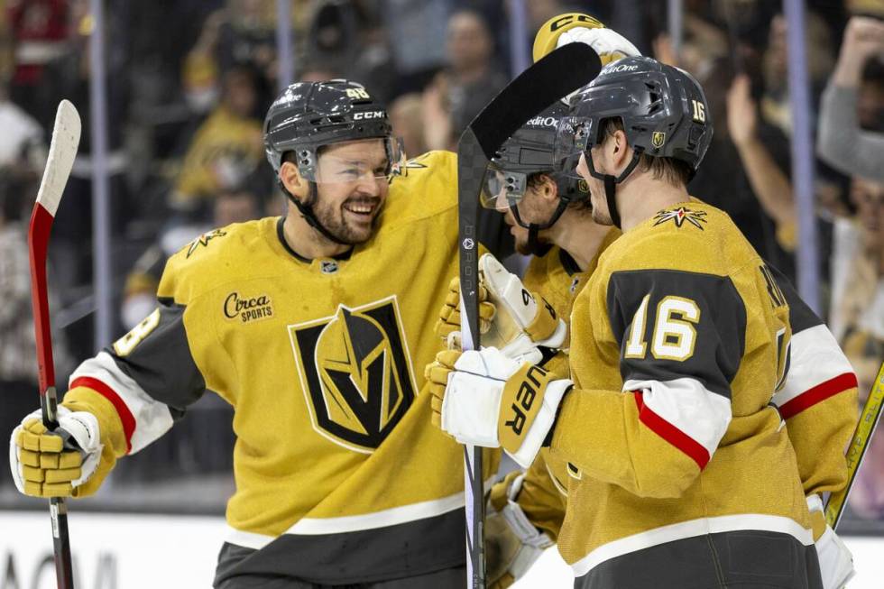 Golden Knights center Tomas Hertl (48) joins his teammates in celebrating after a goal is score ...