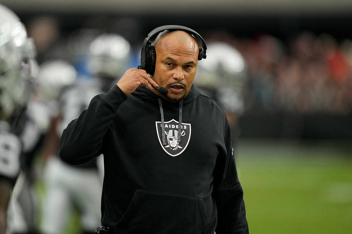 Las Vegas Raiders head coach Antonio Pierce watches from the sidelines during the first half of ...