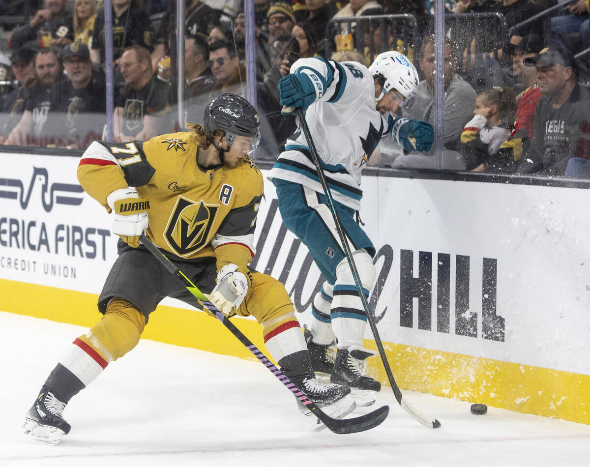 Golden Knights center William Karlsson (71) and San Jose Sharks defenseman Mario Ferraro (38) f ...