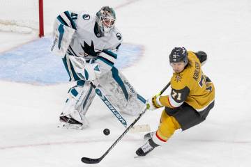 San Jose Sharks goaltender Vitek Vanecek (41) shoots the puck past Golden Knights center Willia ...