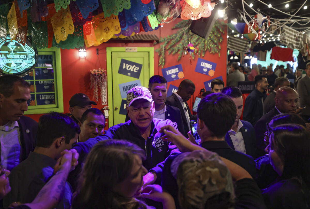 Democratic vice presidential candidate Tim Walz greets supporters at a Latinos con Harris-Walz ...