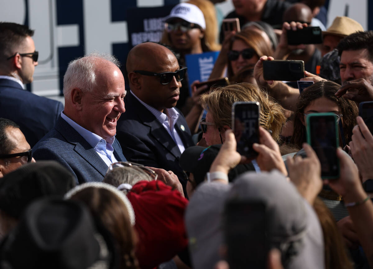 Democratic vice presidential nominee Tim Walz greets members of the crowd at a Harris-Walz camp ...