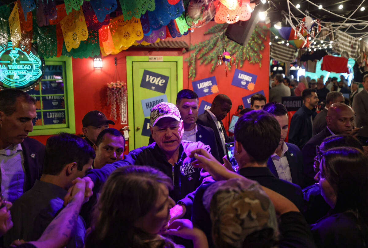 Democratic vice presidential candidate Tim Walz greets supporters at a Latinos con Harris-Walz ...