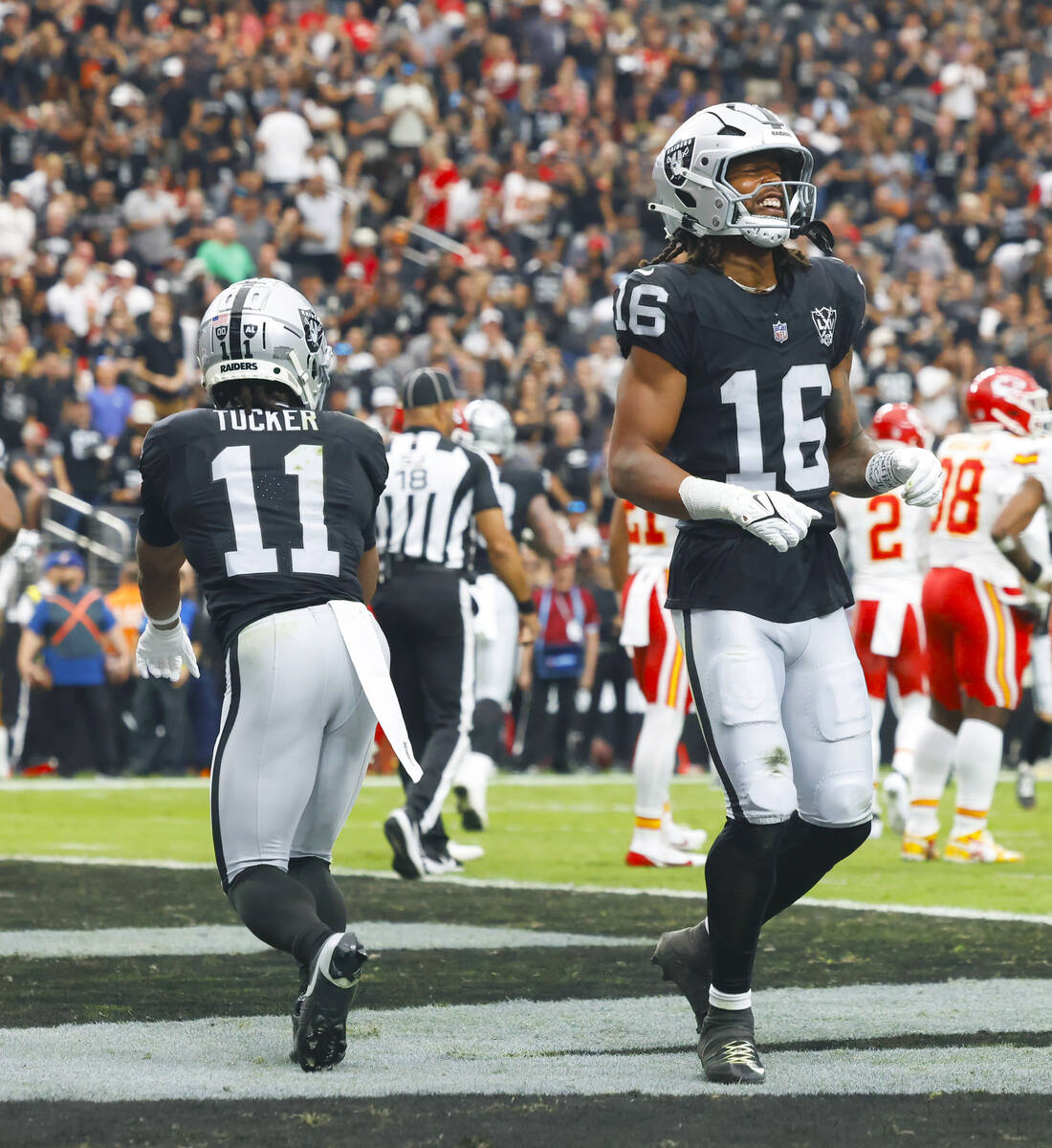 Raiders wide receiver Jakobi Meyers (16) celebrates his touchdown with his teammate wide receiv ...