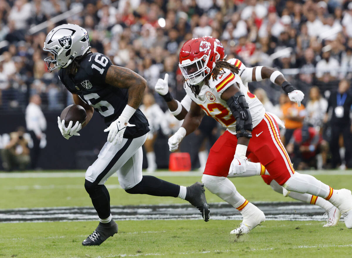 Raiders wide receiver Jakobi Meyers (16) is chased by Kansas City Chiefs linebacker Nick Bolton ...