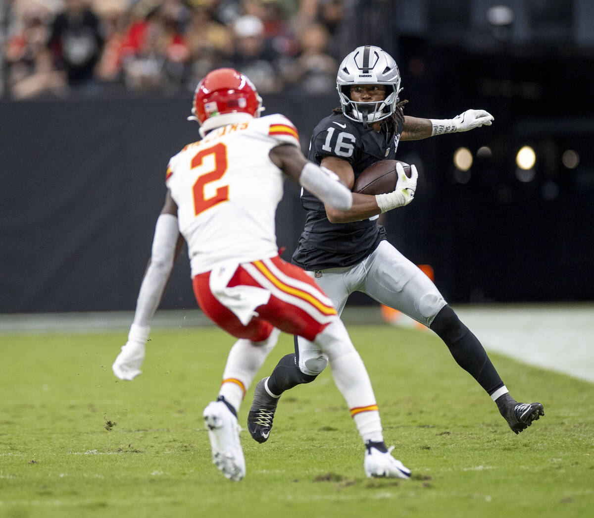 Raiders wide receiver Jakobi Meyers (16) looks to avoid Kansas City Chiefs cornerback Joshua Wi ...