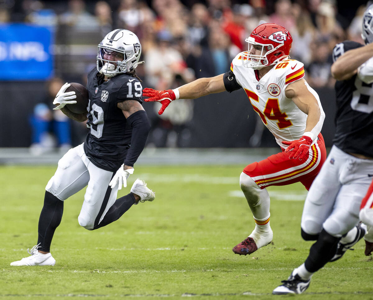 Raiders wide receiver DJ Turner (19) outruns Kansas City Chiefs linebacker Leo Chenal (54) duri ...