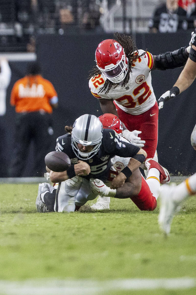 Raiders quarterback Gardner Minshew (15) fumbles the football as he is sacked by Kansas City Ch ...