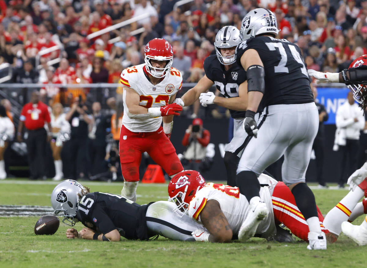 Raiders quarterback Gardner Minshew (15) fumbles the ball after being tackled by Kansas City Ch ...