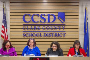 School board members listen to a search firm report about the search for a new distinct superin ...