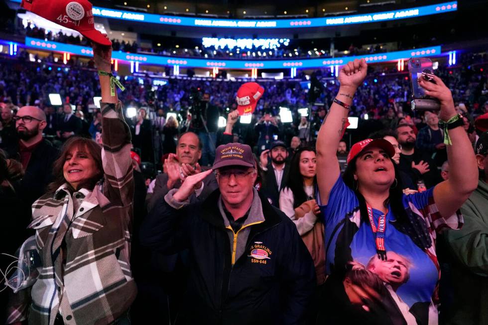 Attendees cheer at a campaign rally for Republican presidential nominee former President Donald ...