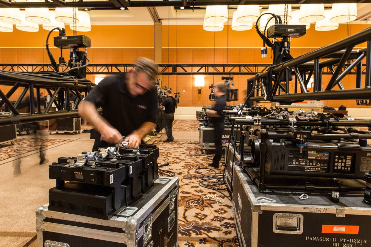 An Encore technician works on an audio-visual presentation for a Las Vegas convention. (Courtes ...