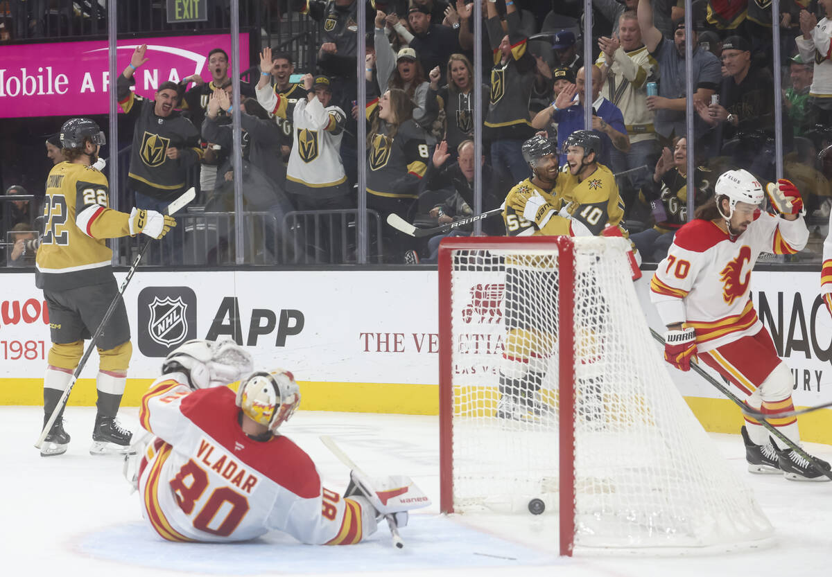 Golden Knights right wing Keegan Kolesar (55) and Golden Knights center Nicolas Roy (10) celebr ...